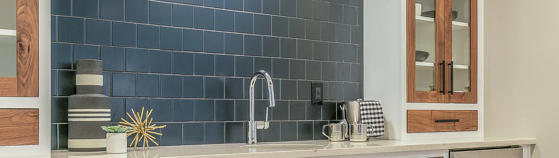 beautiful kitchenette with blue tile back splash